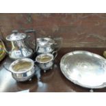 A SILVER PLATED FOUR PIECE TEA SET AND A TRAY.
