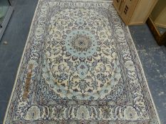 A PERSIAAN RUG OF CLASSIC DEISGN 214 X 197 CM