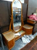 AN ART DECO DRESSING TABLE WITH ELONGATED OVAL MIRROR BACK