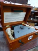 A ER WATTS CLINOMETER IN A MAHOGANY CASE.