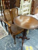 A MAHOGANY TRIPOD TABLE AND A CANE BACK ARMCHAIR.