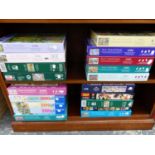 A LARGE COLLECTION OF VARIOUS 1000 PIECE JIGSAW PUZZLES.