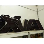 A GROUP OF FIVE LARGE ADVERTISING LETTERS, LETTERS ARE X,U V,A,A.