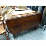 A MAHOGANY DROP FLAP DINING TABLE ON BLIND FRET CARVED SQUARE SECTIONED LEGS