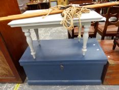 A GREY PAINTED COFFEE TABLE TOGETHER WITH A BLUE PAINTED WOODEN TRUNK AND A LAUNDRY MAID.