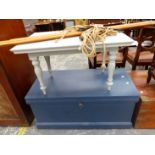 A GREY PAINTED COFFEE TABLE TOGETHER WITH A BLUE PAINTED WOODEN TRUNK AND A LAUNDRY MAID.