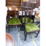 THREE CHIPPENDALE TASTE MAHOGANY DINING CHAIRS INCLUDING ONE WITH ARMS, THE DROP IN SEATS COVERED IN