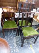 THREE CHIPPENDALE TASTE MAHOGANY DINING CHAIRS INCLUDING ONE WITH ARMS, THE DROP IN SEATS COVERED IN