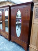 A CHEQUER LINE INLAID MAHOGANY WARDROBE, THE CENTRAL OVAL MIRRORED DOOR OVER A LONG DRAWER