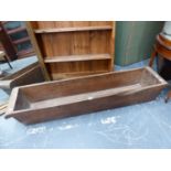 A HOLLOWED WOODEN TROUGH, W. 144 x D. 32 x H. 23cms.