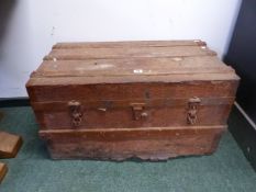 A METAL COVERED TWO HANDLED WOODEN TRUNK