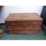 A METAL COVERED TWO HANDLED WOODEN TRUNK