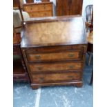 A BURR WALNUT BUREAU WITH BRUSHING SLIDE ABOVE THREE DRAWERS