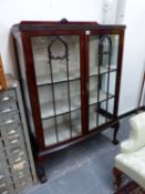 A GLAZED MAHOGANY DISPLAY CABINET ON CABRIOLE LEGS WITH BALL AND CLAW FEET. W 91 x D 36 x H 128cms.