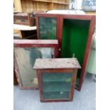 TWO GLAZED MAHOGANY STAINED WALL CUPBOARDS TOGETHER WITH A GLAZED TABLE TOP CABINET