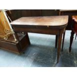 A GEORGE III LINE INLAID MAHOGANY GAMES TABLE OPENING ON SINGLE GATE