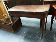 A GEORGE III LINE INLAID MAHOGANY GAMES TABLE OPENING ON SINGLE GATE