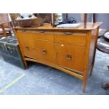 A MAHOGANY SIDE CABINET WITH THREE DRAWERS OVER THREE DOORS