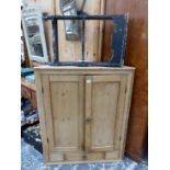 A PINE CORNER CUPBOARD TOGETHER WITH A BLACK PAINTED SET OF WALL SHELVES