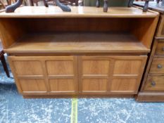 AN OAK SIDE CABINET WITH A SHELF OVER DOORS, EACH WITH FOUR PANELS