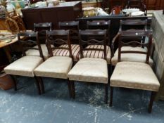 A SET OF EIGHT REGENCY MAHOGANY CHAIRS INCLUDING TWO WITH ARMS. THE HORIZONTAL BAR TO EACH BACK