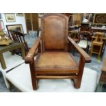 A TEAK AND LEATHER ADJUSTABLE ARM CHAIR