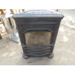 A SMALL CAST IRON FIRE INSERT