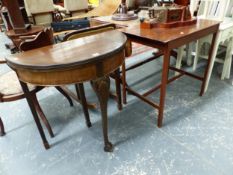 A MAHOGANY RECTANGULAR TABLE TOGETHER WITH A MAHOGANY DEMILUNE GAMES TABLE OPENING ON A DRAW OUT