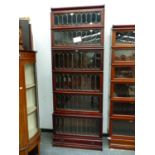 A MAHOGANY GLOBE WERNICKE TYPE CABINET, THE SIX SHELVES COVERED WITH LEADED GLASS ABOVE A SINGLE