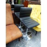 A PAIR OF BLACK LEATHERETTE AND CHROME ADJUSTABLE BAR STOOLS