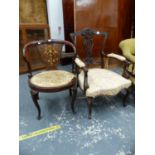 AN EDWARDIAN MARQUETRIED ROSEWOOD DESK CHAIR TOGETHER WITH A CARVED MAHOGANY ELBOW CHAIR