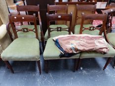 A SET OF SIX REGENCY MAHOGANY DINING CHAIRS TO INCLUDE ONE WITH ARMS, EACH HORIZONTAL BACK RAIL