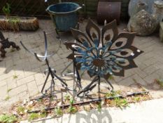 A WROUGHT IRON WIND VANE AND TWO PLANT STANDS