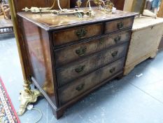 AN 18th C. WALNUT CHEST OF TWO SHORT AND THREE GRADED LONG DRAWERS ON BRACKET FEET