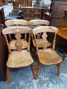 A SET OF FOUR OAK CHAIRS WITH PIERCED BALUSTER SPLATS ABOVE SADDLE SEATS