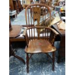 A WINDSOR CHAIR WITH CRINOLINE STRETCHER BELOW THE SADDLE SEAT