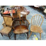 AN OAK AND ELM WINDSOR CHAIR, A HOOP BACK KITCHEN CHAIR AND A CANED NURSING CHAIR