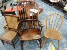 AN OAK AND ELM WINDSOR CHAIR, A HOOP BACK KITCHEN CHAIR AND A CANED NURSING CHAIR