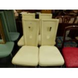 A SET OF FOUR CREAM LEATHER AND CHROME CHAIRS, THE BACKS EACH PIERCED WITH TWO TAPERING SQUARE
