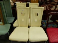 A SET OF FOUR CREAM LEATHER AND CHROME CHAIRS, THE BACKS EACH PIERCED WITH TWO TAPERING SQUARE