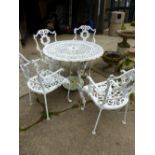 A PAINTED PATIO TABLE AND FOUR CHAIRS