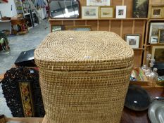 A CANE CUBOID LINEN BASKET WITH LIFT OFF COVER