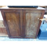 A MAHOGANY TWO DOOR LINEN CHEST CONTAINING SLIDES