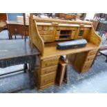 AN OAK SLATTED ROLL TOP DESK ON THREE DRAWER PEDESTALS