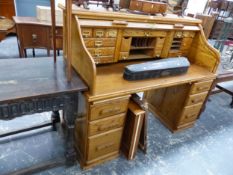 AN OAK SLATTED ROLL TOP DESK ON THREE DRAWER PEDESTALS