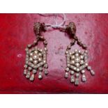 A PAIR OF SILVER AND ROSE GOLD PLATED VICTORIAN STYLE ARTICULATING CHANDELIER DROP EARRINGS. DROP