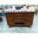 A MAHOGANY SIDEBOARD, THE CENTRAL THREE DRAWERS OVER A SHELF AND FLANKED BY DOORS WITH ARTS AND