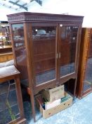 A MAHOGANY DISPLAY CABINET, THE GLAZED DOORS AND SIDES OVER GLASS SHELVES AND ABOVE TAPERING