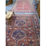 AN ANTIQUE HAND WOVEN RUG AND A LATER RUG