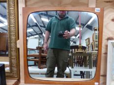 A MID CENTURY TEAK SQUARE FRAME MIRROR, 54 x 54cms. TOGETHER WITH A GILT FRAME MIRROR AND TWO
